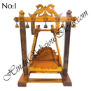 A wooden swing with peacock designs, handcrafted and intended for home use.