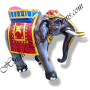 A fiber elephant statue with a colorful saddle and ornate design, intended for religious festivals and celebrations.