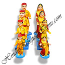 A set of colorful fiber statues depicting characters in traditional attire, likely used for decoration purposes.