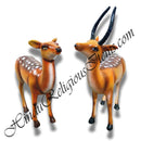Two animal fiber swarup statues of deer with intricate artwork, one looking straight ahead and the other looking to the side.