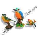 A set of colorful bird figurines made of fiber, featuring different species, perched on branches.