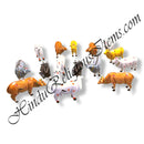A collection of fiber statues of various colored cows with and without patterns, positioned against a white background.