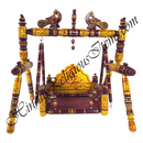 Decorative wooden swing with intricate designs on a white background