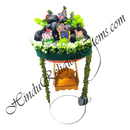 Decorative headpiece with religious symbols and greenery on a white background