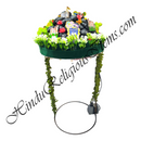 Decorative headpiece with religious symbols and greenery on a white background