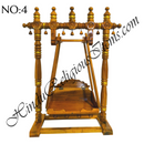 A wooden hindola (swing) with handcrafted woodwork, featuring a detachable seat, in a natural wood color.
