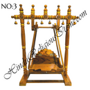 A wooden hindola (swing) with handcrafted woodwork, featuring a detachable seat, in a natural wood color.